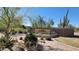 Beautiful entrance to the Carmel community featuring desert landscaping at 8633 E Kael Cir, Mesa, AZ 85207