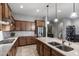 Well-appointed kitchen with granite countertops, stainless steel appliances, and ample cabinet space at 8633 E Kael Cir, Mesa, AZ 85207