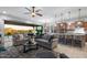 Spacious living room with modern furnishings that seamlessly connect to the gourmet kitchen and outdoor spaces at 8633 E Kael Cir, Mesa, AZ 85207