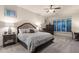 Comfortable main bedroom featuring cozy furniture, soft lighting, and plantation shutters at 8633 E Kael Cir, Mesa, AZ 85207