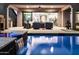 Backyard pool and patio area with a water feature and ample space for outdoor entertaining at 8633 E Kael Cir, Mesa, AZ 85207
