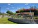 A beautifully landscaped Mountain Bridge community sign with mature trees and shrubs at 8633 E Kael Cir, Mesa, AZ 85207
