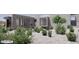 Contemporary home with desert landscaping, showcasing native plants and modern design at 9002 E Havasupai Dr, Scottsdale, AZ 85255