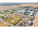 An aerial shot showcases school sports fields including baseball, tennis, and track areas at 948 E Wiley Way, Casa Grande, AZ 85122