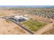 Scenic aerial view of a school and sports fields in a well-planned desert community at 948 E Wiley Way, Casa Grande, AZ 85122