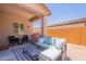 Covered patio area with outdoor seating, ideal for relaxing and entertaining at 948 E Wiley Way, Casa Grande, AZ 85122