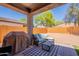 Inviting back patio featuring comfortable outdoor seating and a BBQ grill for entertaining at 948 E Wiley Way, Casa Grande, AZ 85122