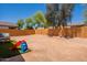 Large backyard with a brick wall, perfect for privacy and outdoor entertaining, plus slide for fun at 948 E Wiley Way, Casa Grande, AZ 85122