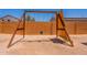 Backyard featuring a wooden playset and climbing wall for outdoor fun at 948 E Wiley Way, Casa Grande, AZ 85122
