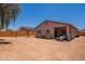 Spacious backyard featuring a covered patio, play area, and ample space for outdoor activities at 948 E Wiley Way, Casa Grande, AZ 85122