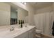 Bright bathroom featuring double sinks, a separate water closet, and walk-in closet at 948 E Wiley Way, Casa Grande, AZ 85122