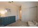 Cozy bedroom featuring a large dresser, closet with sliding doors and a comfortable chair at 948 E Wiley Way, Casa Grande, AZ 85122