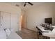 Spare bedroom featuring a keyboard, neutral colors, a sofa and a ceiling fan at 948 E Wiley Way, Casa Grande, AZ 85122