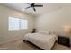 Comfortable bedroom with neutral tones, window, and minimalist décor at 948 E Wiley Way, Casa Grande, AZ 85122