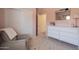 Charming Bedroom featuring a glider, dresser, and closet with sliding doors at 948 E Wiley Way, Casa Grande, AZ 85122