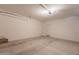 Clean, empty garage with sealed concrete flooring and white walls at 948 E Wiley Way, Casa Grande, AZ 85122