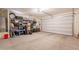 Spacious garage with shelving, storage containers, and ample parking space at 948 E Wiley Way, Casa Grande, AZ 85122
