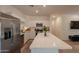Spacious kitchen with stainless steel appliances, quartz countertops, and white cabinets at 948 E Wiley Way, Casa Grande, AZ 85122