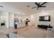 The living room has neutral paint, recessed lighting, a ceiling fan and tile flooring at 948 E Wiley Way, Casa Grande, AZ 85122