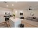 Open concept living area connecting to kitchen with modern decor and plenty of natural light at 948 E Wiley Way, Casa Grande, AZ 85122