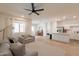 The living room has neutral paint, recessed lighting, a ceiling fan and tile flooring at 948 E Wiley Way, Casa Grande, AZ 85122