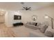The living room has neutral paint, recessed lighting, a ceiling fan and tile flooring at 948 E Wiley Way, Casa Grande, AZ 85122