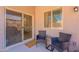 Cozy patio with sliding glass doors, comfortable seating, and natural light at 948 E Wiley Way, Casa Grande, AZ 85122