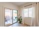 Bright sunroom area showcasing a sliding glass door leading to the outdoor patio at 948 E Wiley Way, Casa Grande, AZ 85122