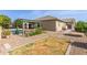 Spacious backyard featuring a pool with pergola, patio seating, and low-maintenance landscaping at 1036 W Siebold Tree Ave, Queen Creek, AZ 85140