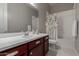 Bathroom featuring a modern vanity with a white countertop and neutral paint at 1036 W Siebold Tree Ave, Queen Creek, AZ 85140