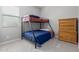 Bedroom featuring a bunk bed, dresser, and neutral tones at 1036 W Siebold Tree Ave, Queen Creek, AZ 85140