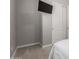 Bedroom showing closet, neutral tones, carpet, and a mounted TV at 1036 W Siebold Tree Ave, Queen Creek, AZ 85140