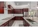 Modern kitchen featuring stainless steel appliances, granite countertops, and stylish cabinetry at 1036 W Siebold Tree Ave, Queen Creek, AZ 85140