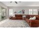 Large living room with a large sectional couch, ceiling fan and an area rug at 1036 W Siebold Tree Ave, Queen Creek, AZ 85140
