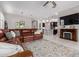 Spacious living room showcases an open floor plan and a decorative rug at 1036 W Siebold Tree Ave, Queen Creek, AZ 85140