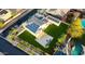 Aerial view of a home with solar panels, a well maintained lawn and a pool at 11737 N 143Rd Dr, Surprise, AZ 85379