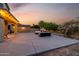 Large backyard featuring an extended patio area with string lights, ideal for outdoor entertaining at 11737 N 143Rd Dr, Surprise, AZ 85379