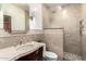 Bathroom with a glass enclosed shower, vanity, and toilet area at 11737 N 143Rd Dr, Surprise, AZ 85379