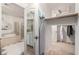 Bathroom featuring a soaking tub, separate shower, vanity, and walk-in closet for added convenience at 11737 N 143Rd Dr, Surprise, AZ 85379