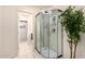 Modern shower with glass doors and luxurious shower head at 11737 N 143Rd Dr, Surprise, AZ 85379