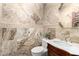 Elegant powder room showcases custom tilework, a marble vanity, and decorative accents at 11737 N 143Rd Dr, Surprise, AZ 85379