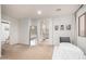 Large bedroom featuring carpet, a bed, and some décor at 11737 N 143Rd Dr, Surprise, AZ 85379