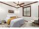 This bedroom features a ceiling fan, wood trim, and modern decor, creating a cozy retreat at 11737 N 143Rd Dr, Surprise, AZ 85379