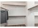 Spacious walk-in closet with ample shelving and clothing racks at 11737 N 143Rd Dr, Surprise, AZ 85379