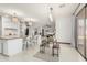 Open concept dining area with breakfast bar, tile flooring and outdoor patio view at 11737 N 143Rd Dr, Surprise, AZ 85379