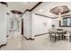 Elegant dining room featuring modern decor, coffered ceilings, and tile flooring at 11737 N 143Rd Dr, Surprise, AZ 85379