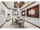 Elegant dining room with designer ceiling, chandelier, large mirror, and seating for six at 11737 N 143Rd Dr, Surprise, AZ 85379