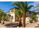 Inviting two-story home featuring well-maintained landscaping and desert rock front yard at 11737 N 143Rd Dr, Surprise, AZ 85379