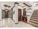 Grand foyer with intricate ceiling details, tile floors, and rich wood accents throughout at 11737 N 143Rd Dr, Surprise, AZ 85379