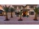 Inviting home exterior featuring a welcoming porch, desert landscaping, and stylish accents at 11737 N 143Rd Dr, Surprise, AZ 85379